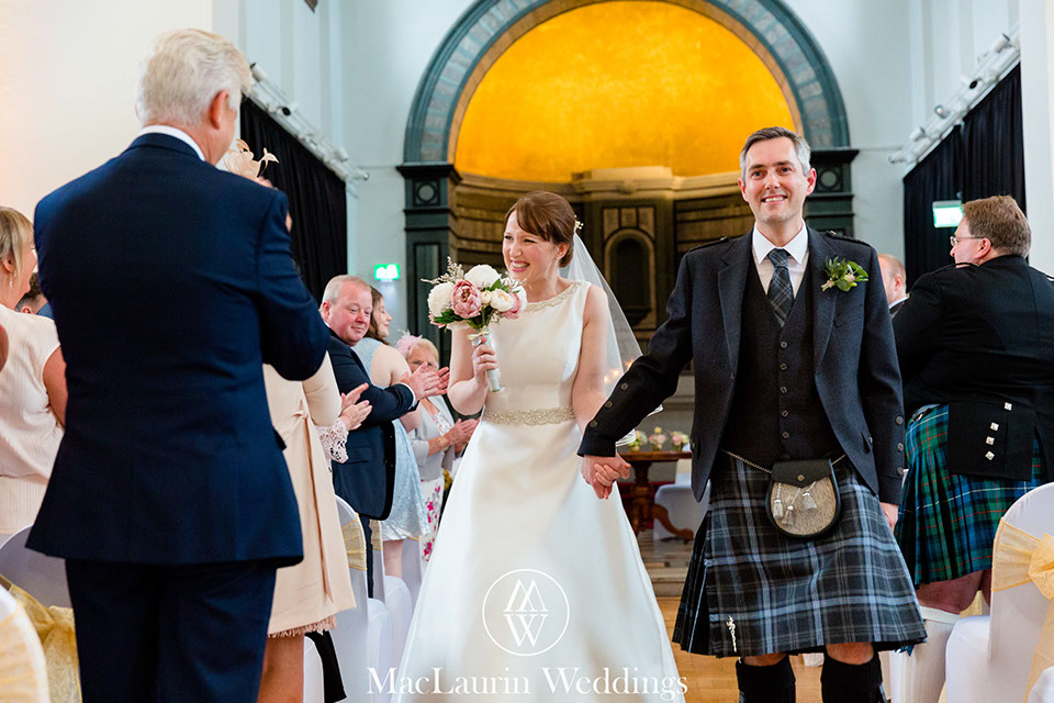 happy bride and groom at the rivers suite napier university  a happy bride and groom leaving the ceremony at the rivers suite napier university