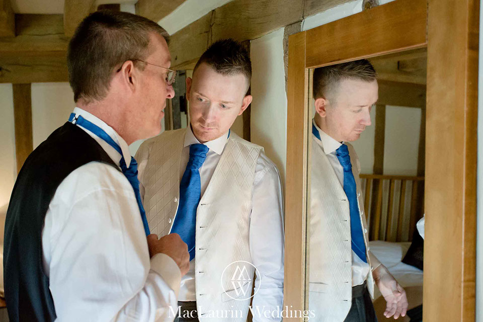 father of the bride and guest father of the bride and guest getting ready before the wedding