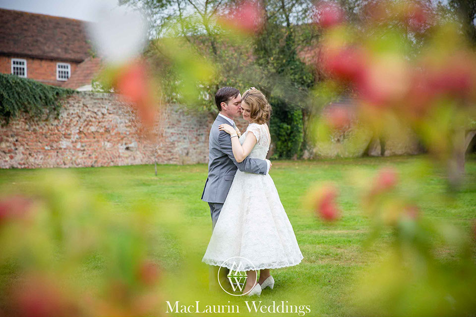 bride and groom embrace bride and groom embrace during a portrait