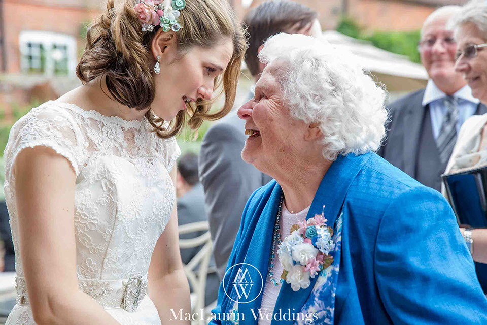 bride and her grandmother a documentay wedding photograph capturing a bride with her grandmother during the receiving line