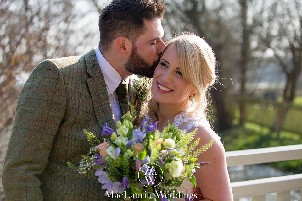 groom kisses bride an intimate kiss with the bride