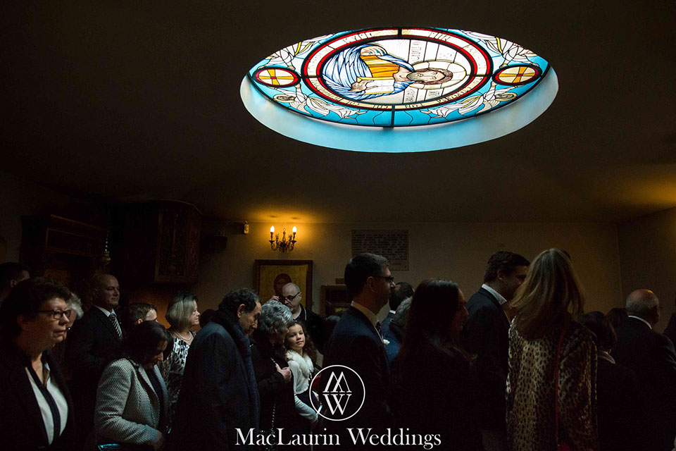 a traditional greek wedding guests filing out of the church after a traditional greek wedding