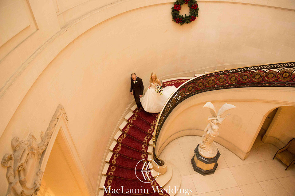 bride and her father on the stairs bride and her father on the stairs